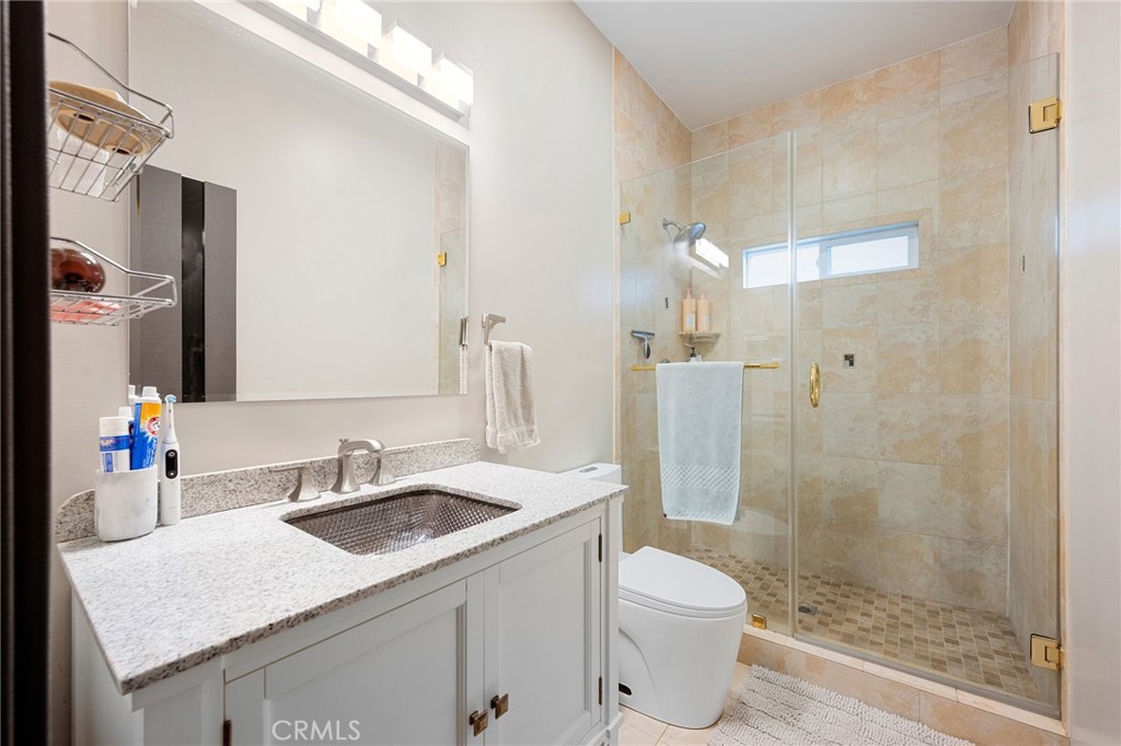 3331 Oakmont View Drive Glendale, CA 91208 - Photo 42 of 50 a bathroom with a sink toilet and shower