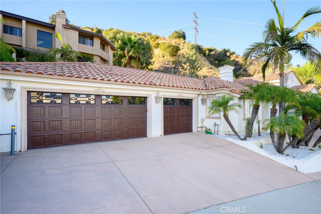 3331 Oakmont View Drive Glendale, CA 91208 - Photo 46 of 50 a view of a house with a yard and potted plants