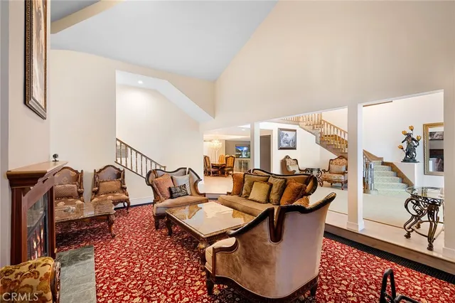 a living room with furniture rug and wooden floor
