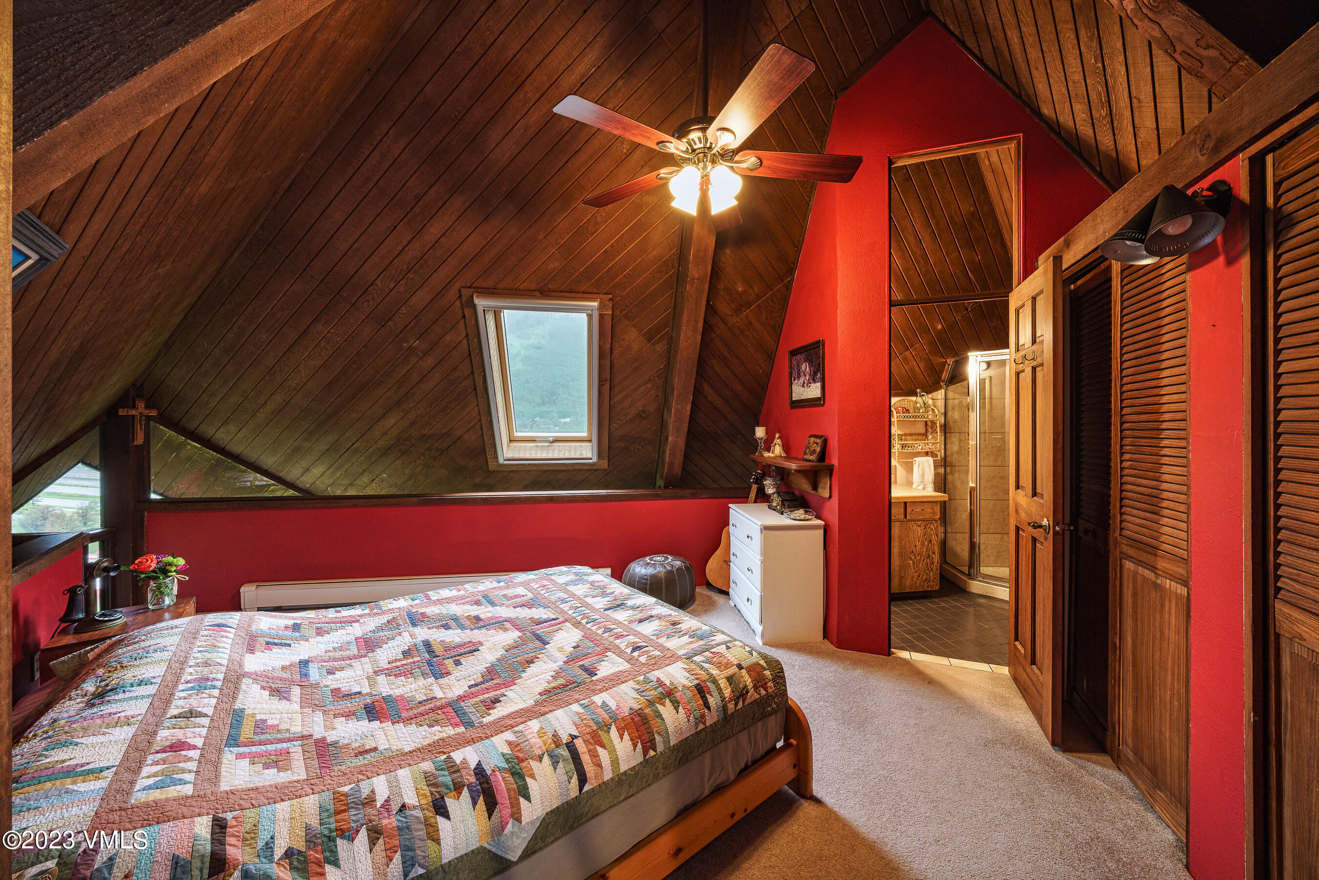 1400 Lions Ridge Loop, Unit A2 Vail, CO 81657 - Photo 11 of 38 a bed sitting in a bedroom next to a window