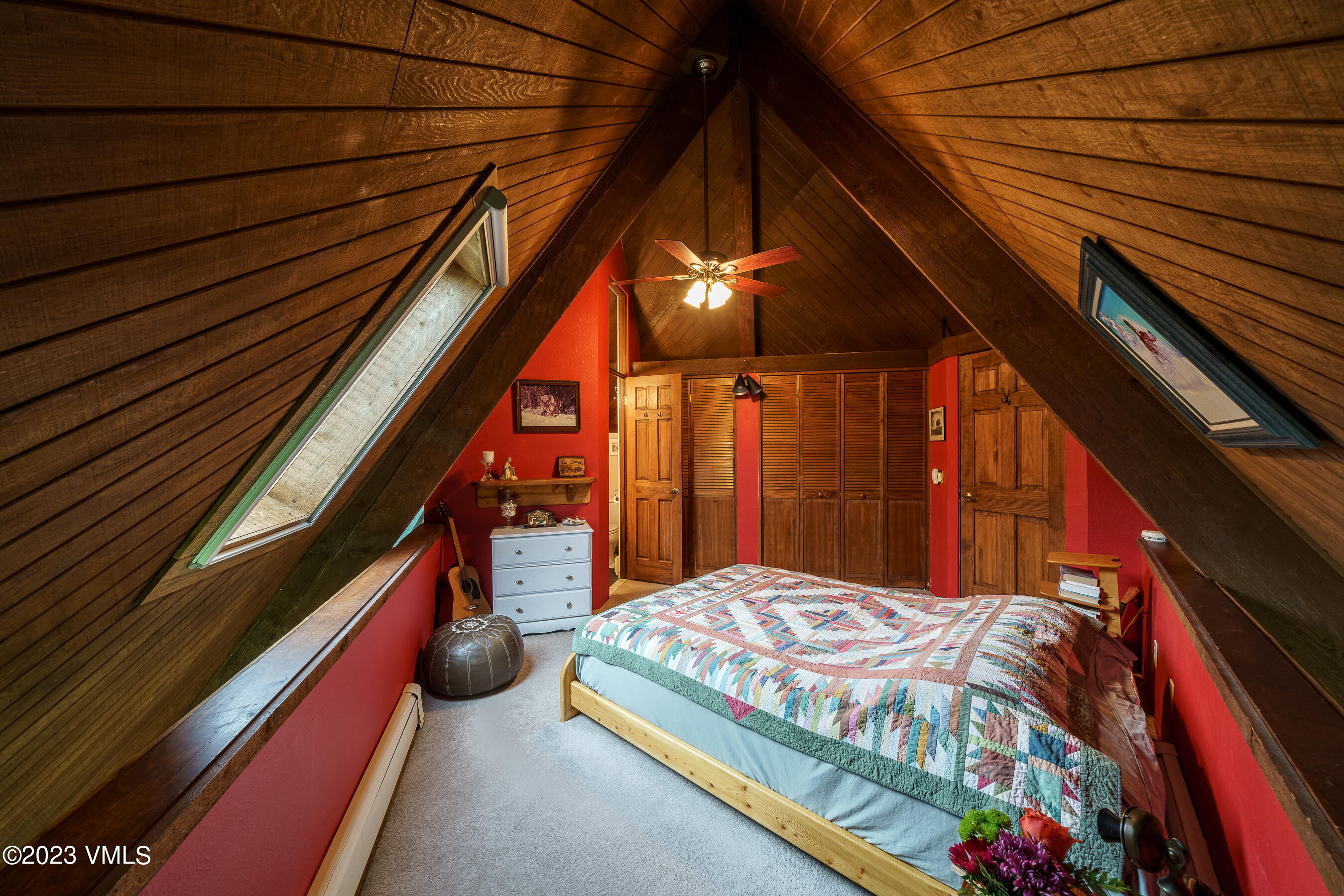 1400 Lions Ridge Loop, Unit A2 Vail, CO 81657 - Photo 13 of 38 a bedroom with a bed and a painting on the wall