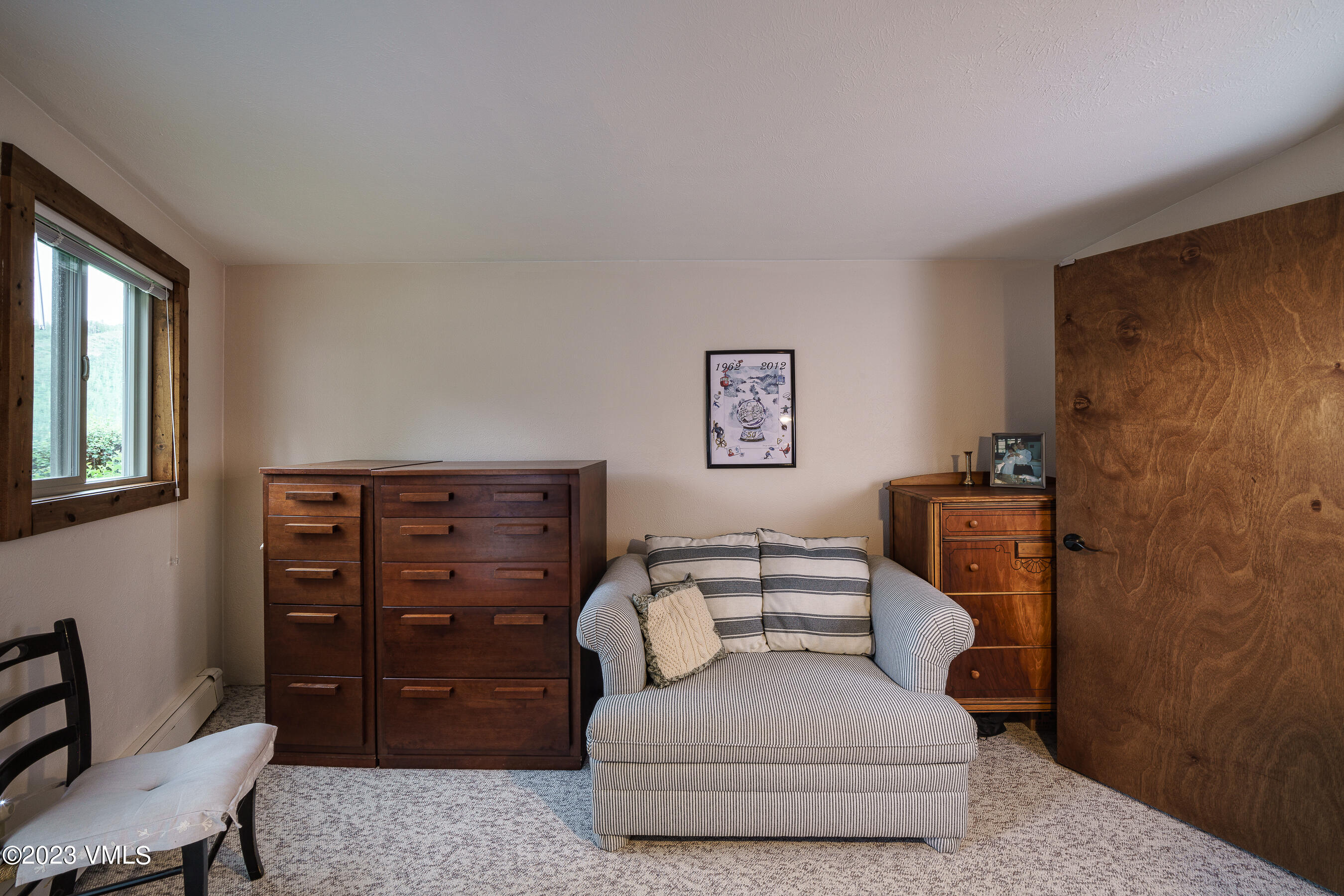 1400 Lions Ridge Loop, Unit A2 Vail, CO 81657 - Photo 15 of 38 a living room with furniture and a chair