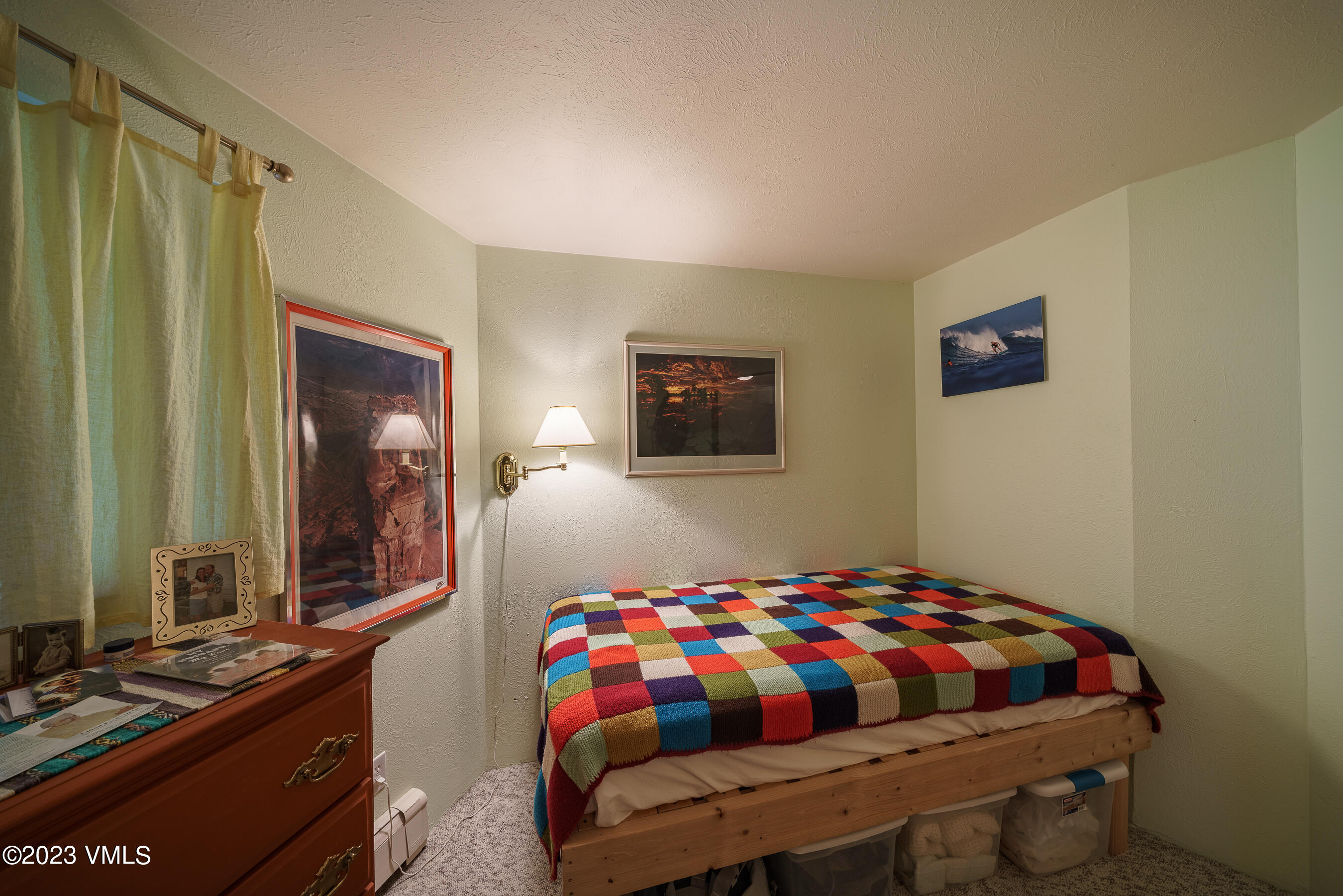 1400 Lions Ridge Loop, Unit A2 Vail, CO 81657 - Photo 19 of 38 a bedroom with a bed and dresser