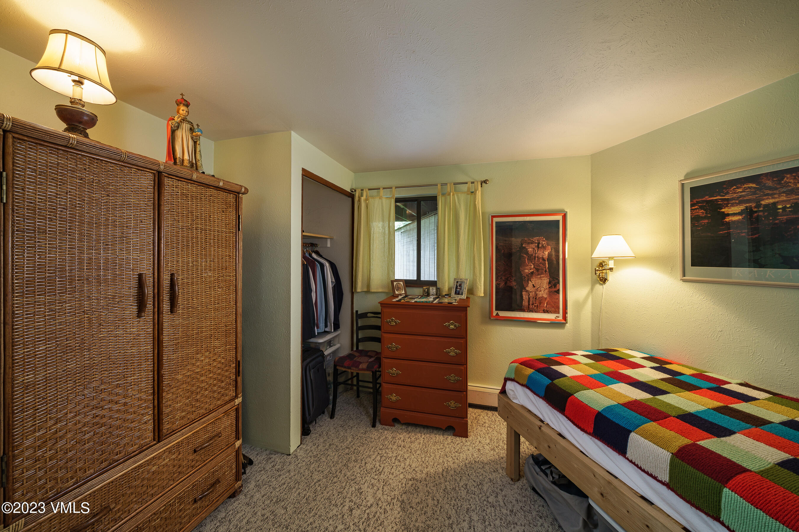 1400 Lions Ridge Loop, Unit A2 Vail, CO 81657 - Photo 20 of 38 a bedroom with a bed and furniture