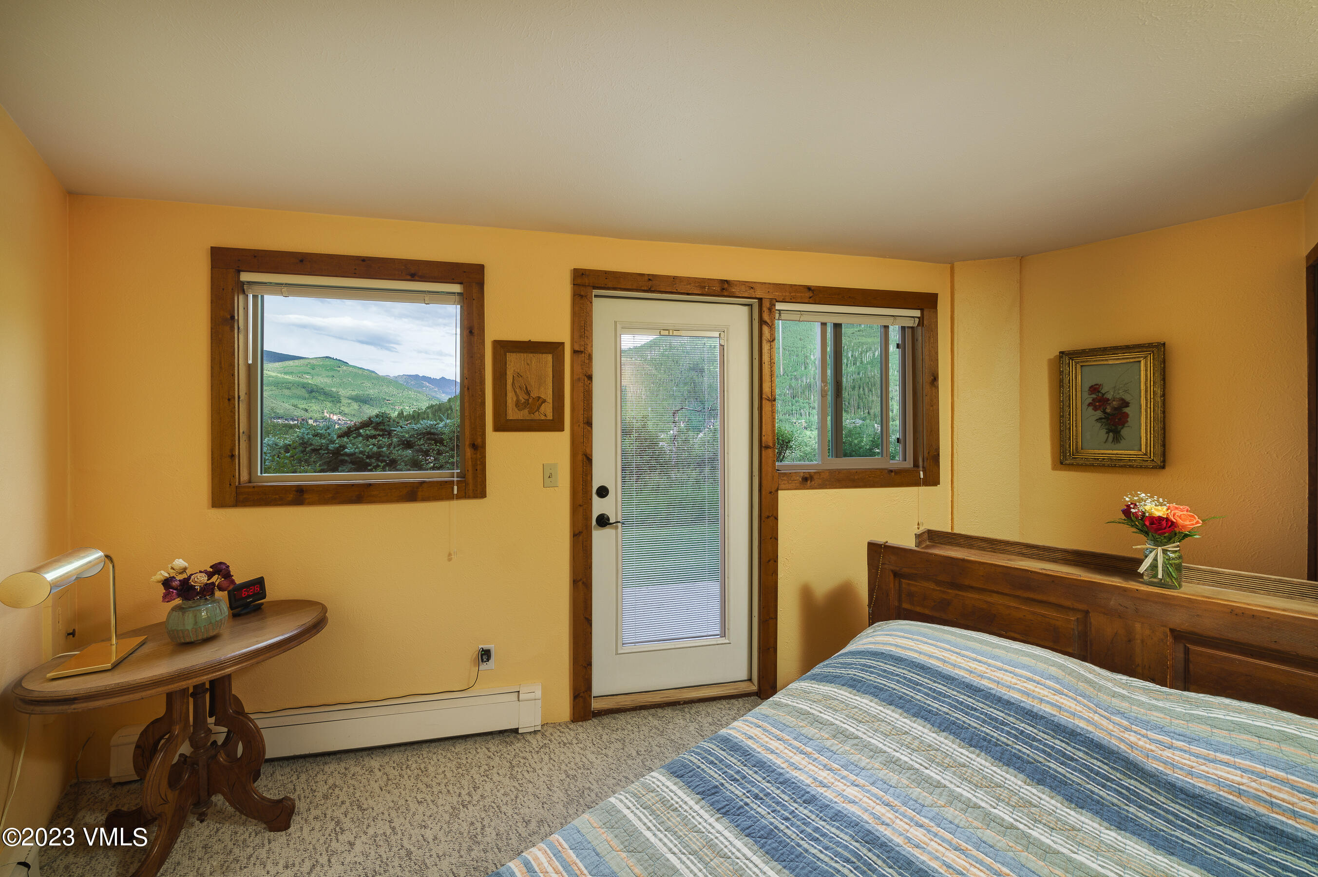 1400 Lions Ridge Loop, Unit A2 Vail, CO 81657 - Photo 21 of 38 a bedroom with a bed and wooden floor