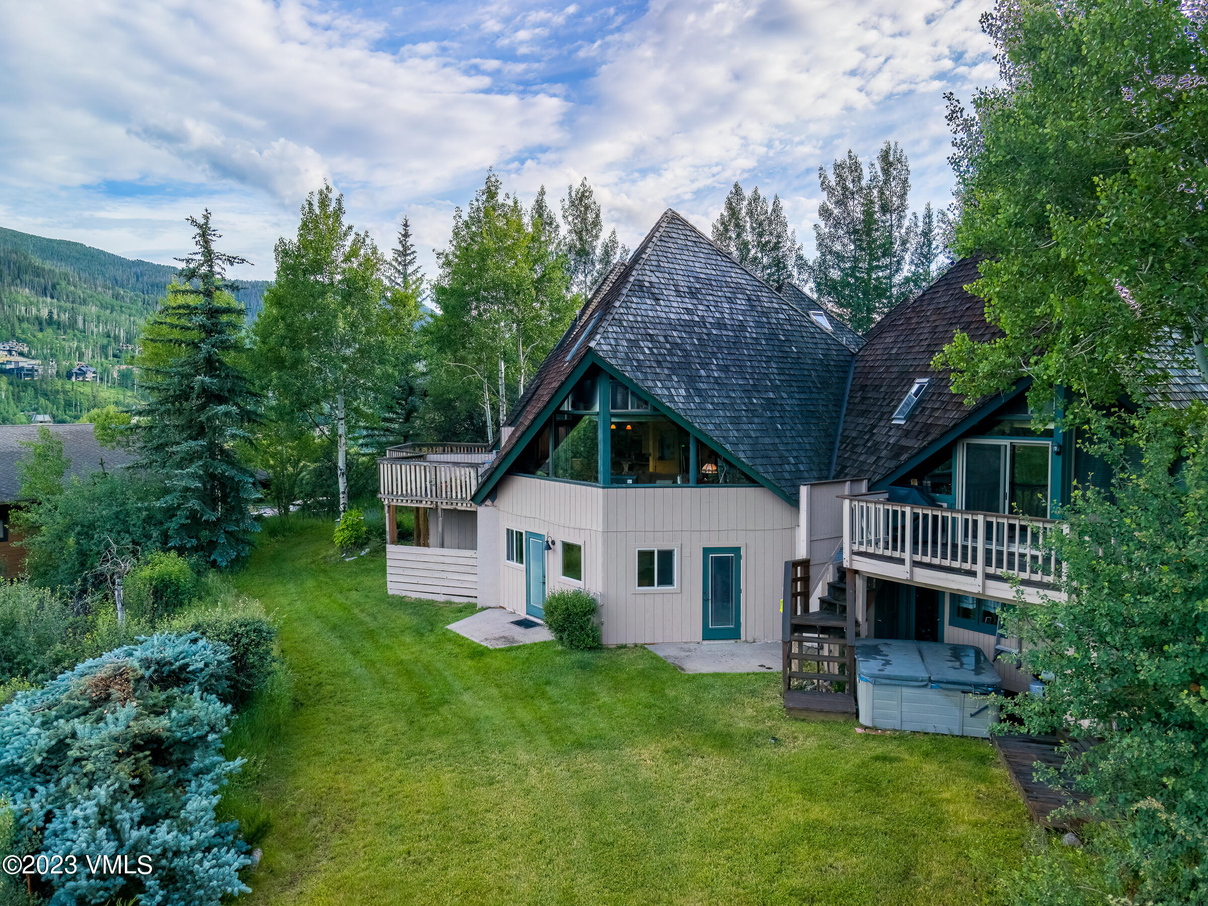 1400 Lions Ridge Loop, Unit A2 Vail, CO 81657 - Photo 25 of 38 a view of a house with a backyard and stairs