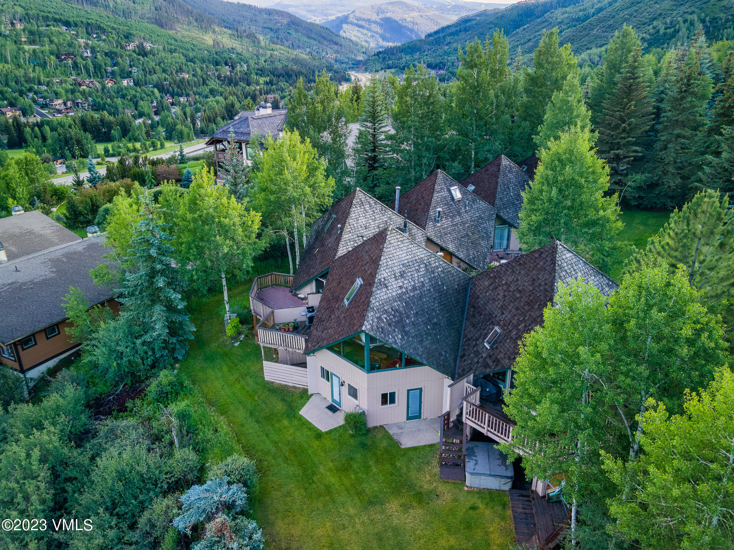 1400 Lions Ridge Loop, Unit A2 Vail, CO 81657 - Photo 26 of 38 an aerial view of a house with garden space and street view