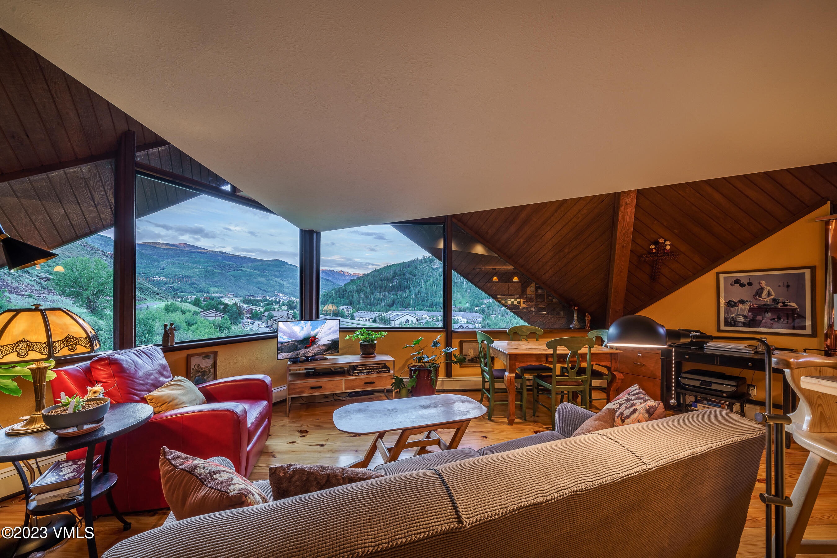 1400 Lions Ridge Loop, Unit A2 Vail, CO 81657 - Photo 28 of 38 a group of chairs sitting in patio with a fire pit and furniture