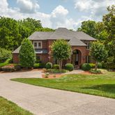 a front view of a house with garden and porch