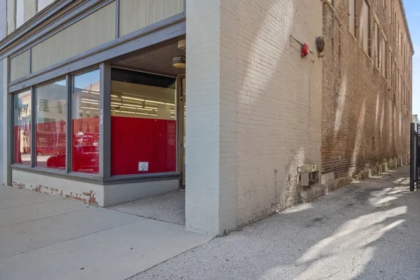 a front view of a building with retail shops
