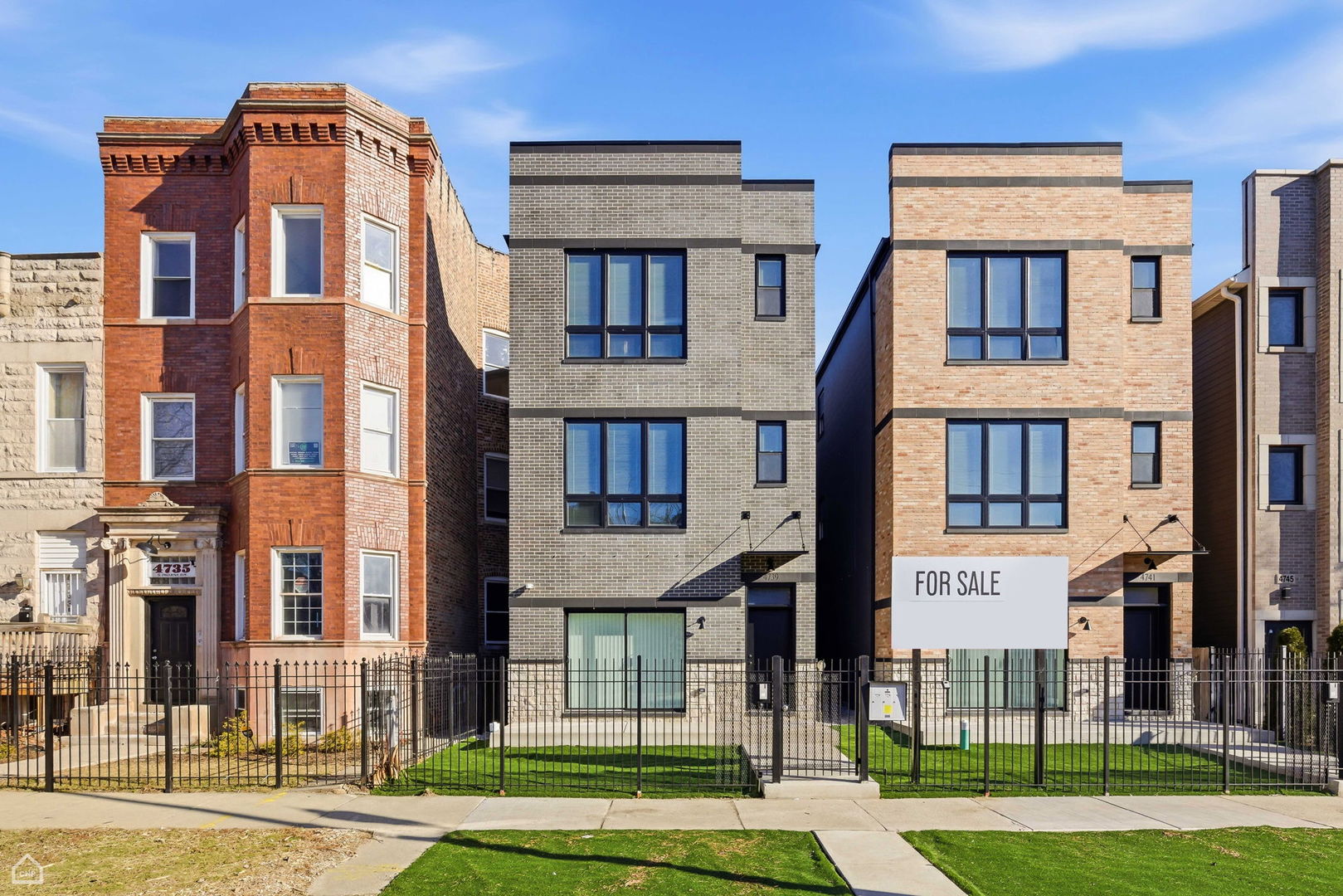 4739 South Indiana Avenue Chicago, IL 60615 - Photo 1 of 38 a front view of a residential apartment building with a yard