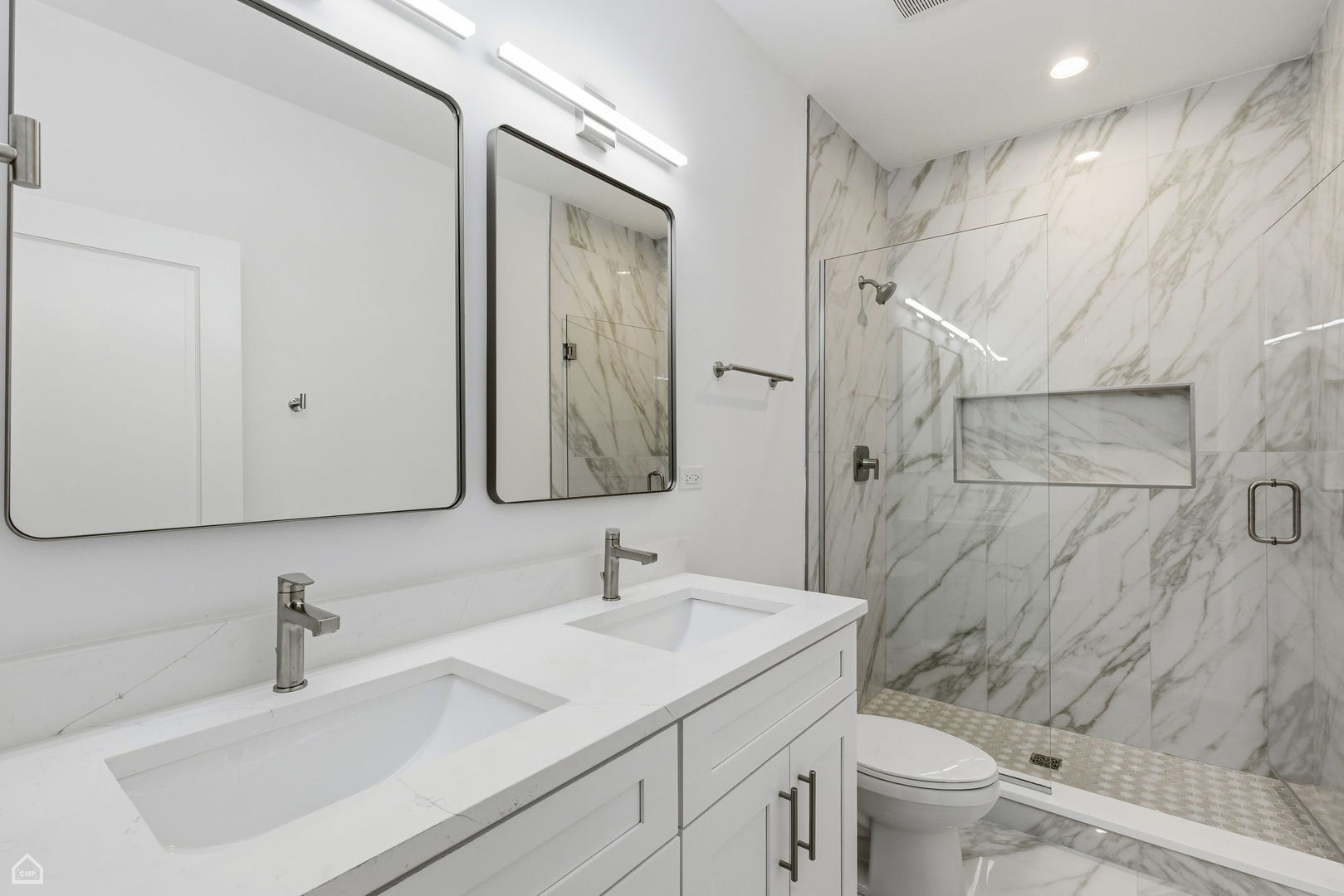 4739 South Indiana Avenue Chicago, IL 60615 - Photo 15 of 38 a bathroom with a sink toilet double vanity and shower