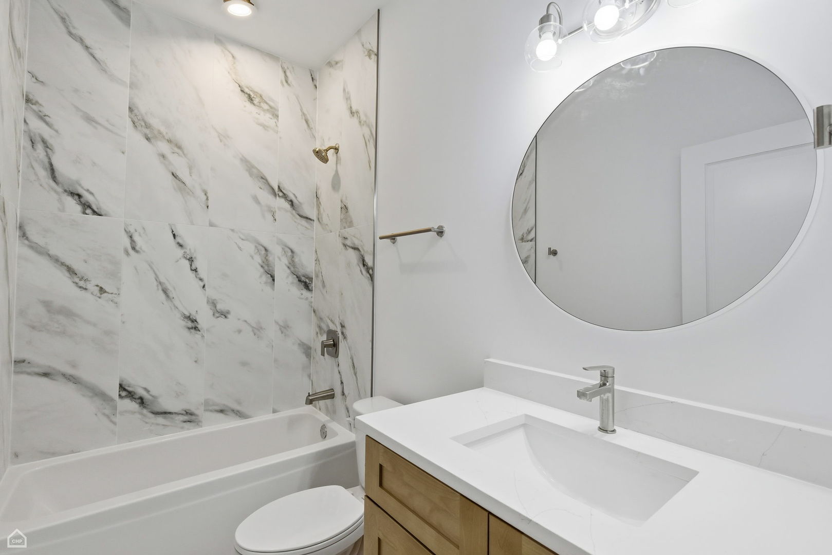 4739 South Indiana Avenue Chicago, IL 60615 - Photo 23 of 38 a bathroom with a sink toilet and shower