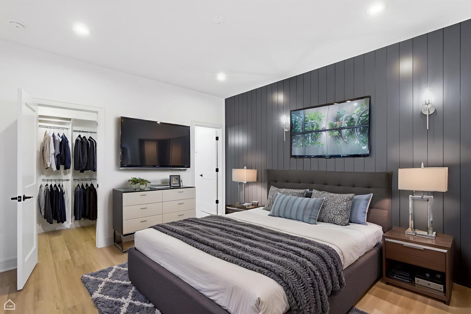 4739 South Indiana Avenue Chicago, IL 60615 - Photo 35 of 38 a bedroom with a bed and a flat screen tv