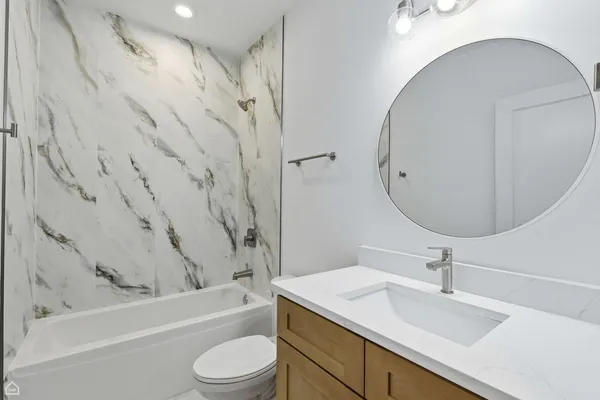 a bathroom with a sink toilet and a bathtub