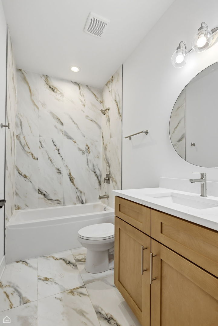 4739 South Indiana Avenue Chicago, IL 60615 - Photo 10 of 38 a bathroom with a sink toilet and shower