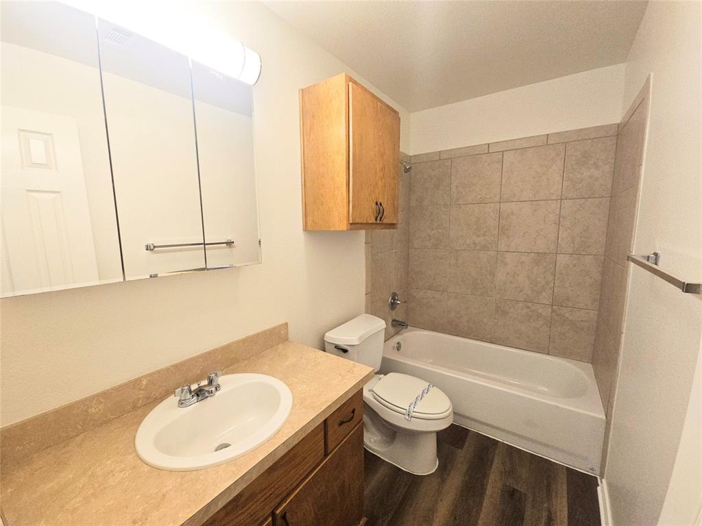 508 East Denton Drive Euless, TX 76039 - Photo 21 of 22 a bathroom with a sink toilet and shower