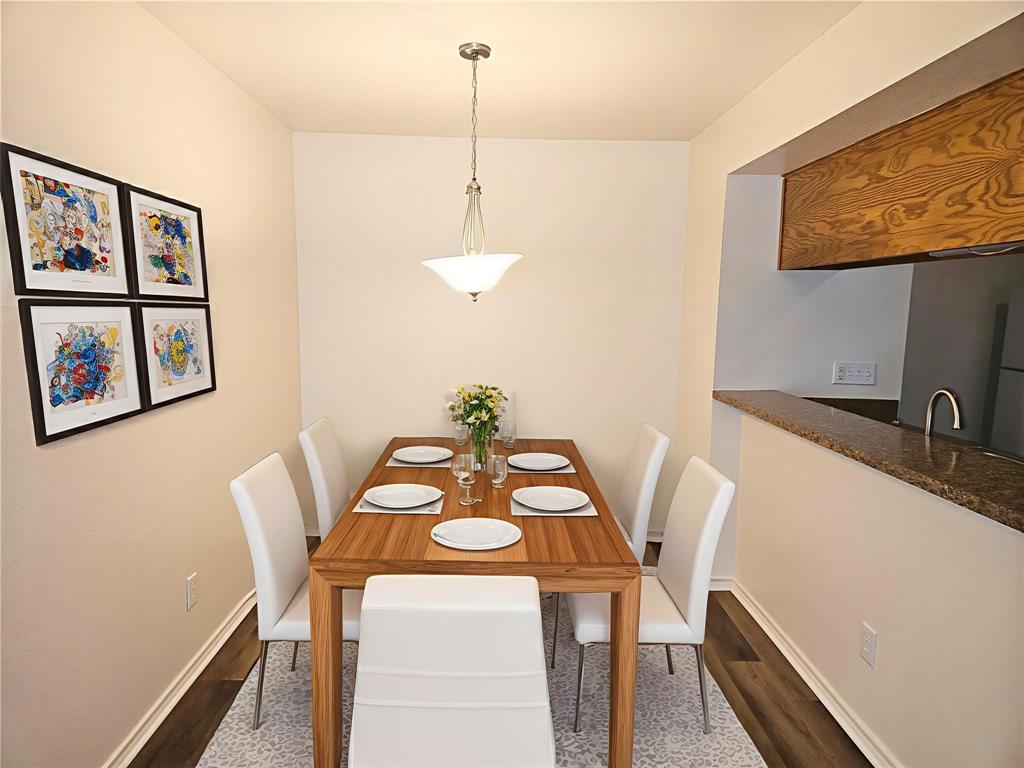508 East Denton Drive Euless, TX 76039 - Photo 5 of 22 a view of a dining room with furniture and wooden floor