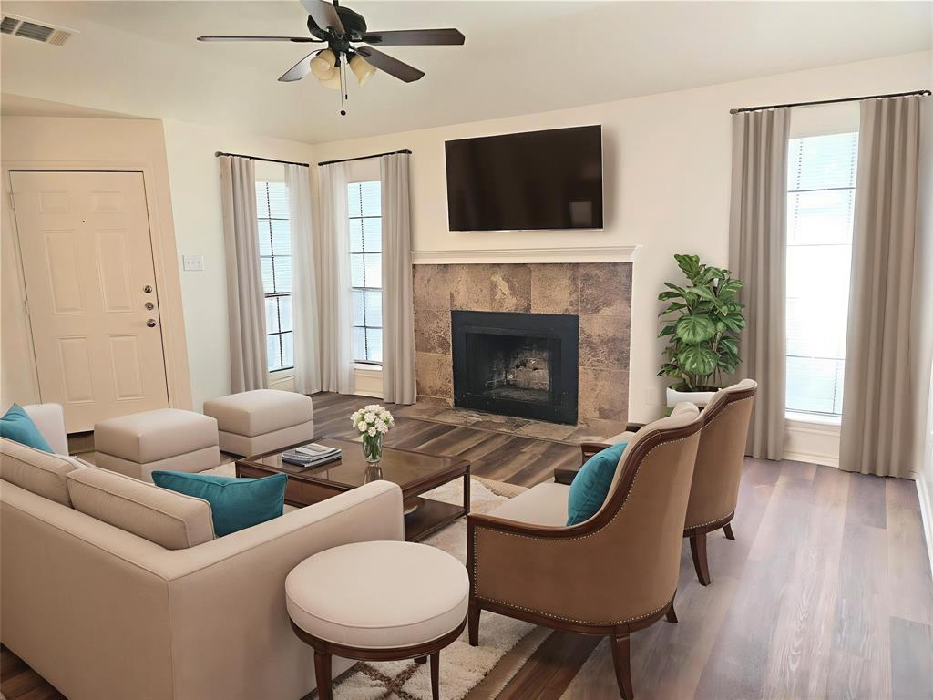 508 East Denton Drive Euless, TX 76039 - Photo 7 of 22 a living room with furniture a fireplace and a flat screen tv