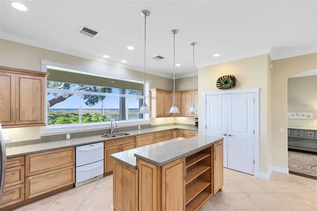 a kitchen with stainless steel appliances granite countertop a stove and a sink