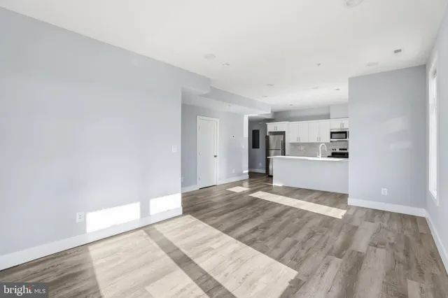 a view of a livingroom with wooden floor
