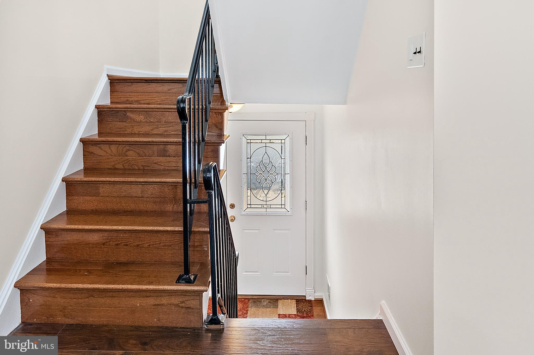 9504 Covington Place Manassas, VA 20109 - Photo 6 of 40 Front Entrance steps into Stunning Wood Flooring