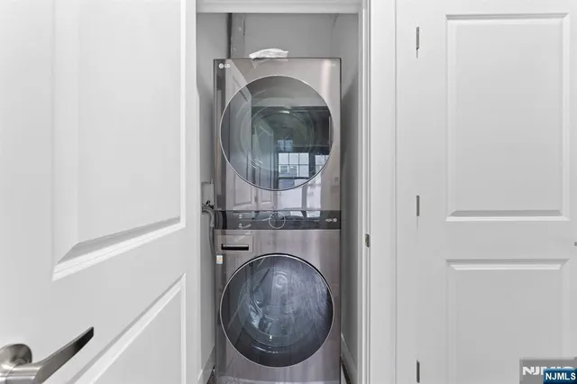 a view of a hallway with washer and dryer