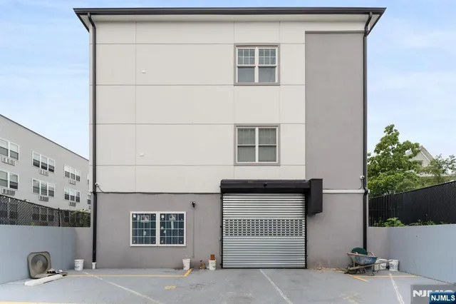 a front view of a house with a garage