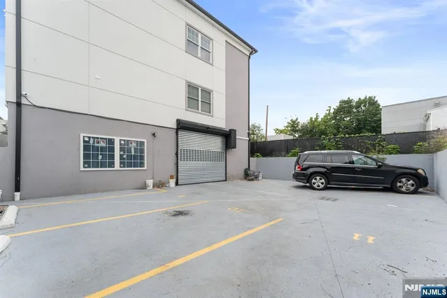 a view of a car parked in front of a house
