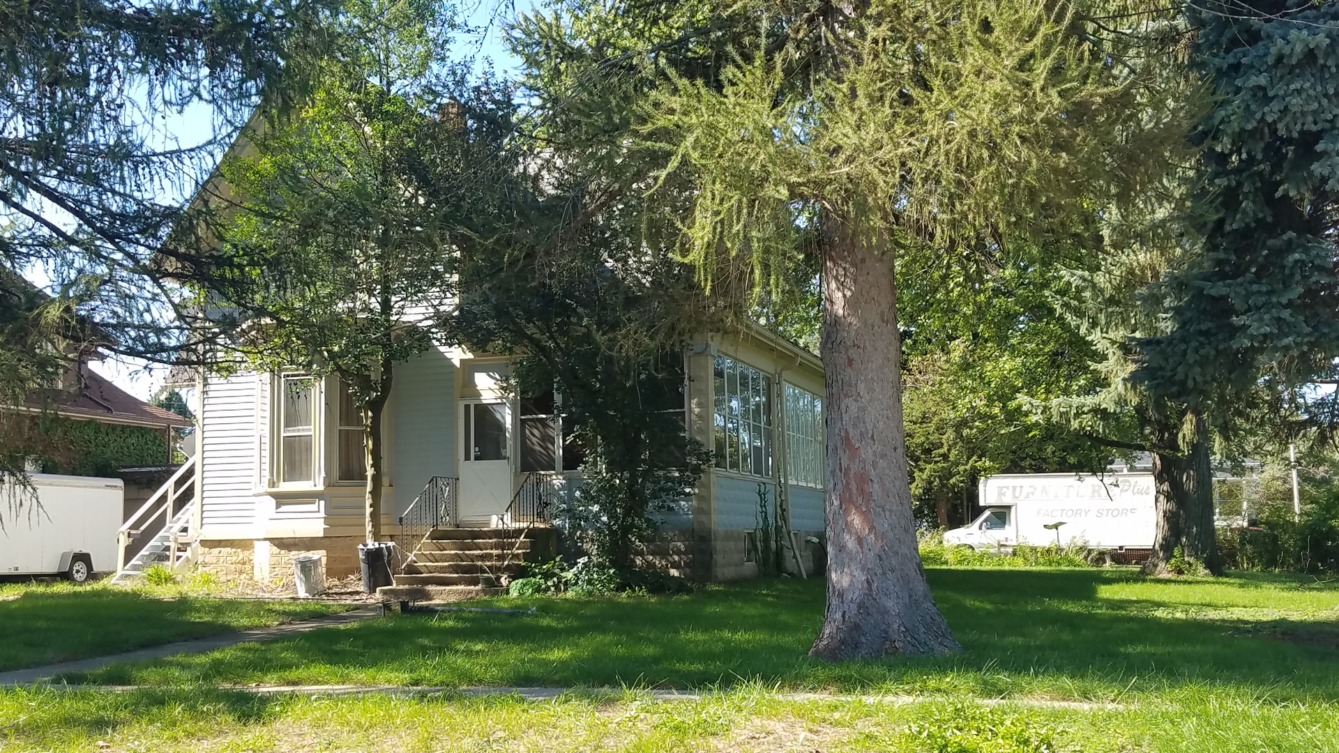 426 North 11th Street Rochelle, IL 61068 - Photo 2 of 18 a view of a backyard with large trees
