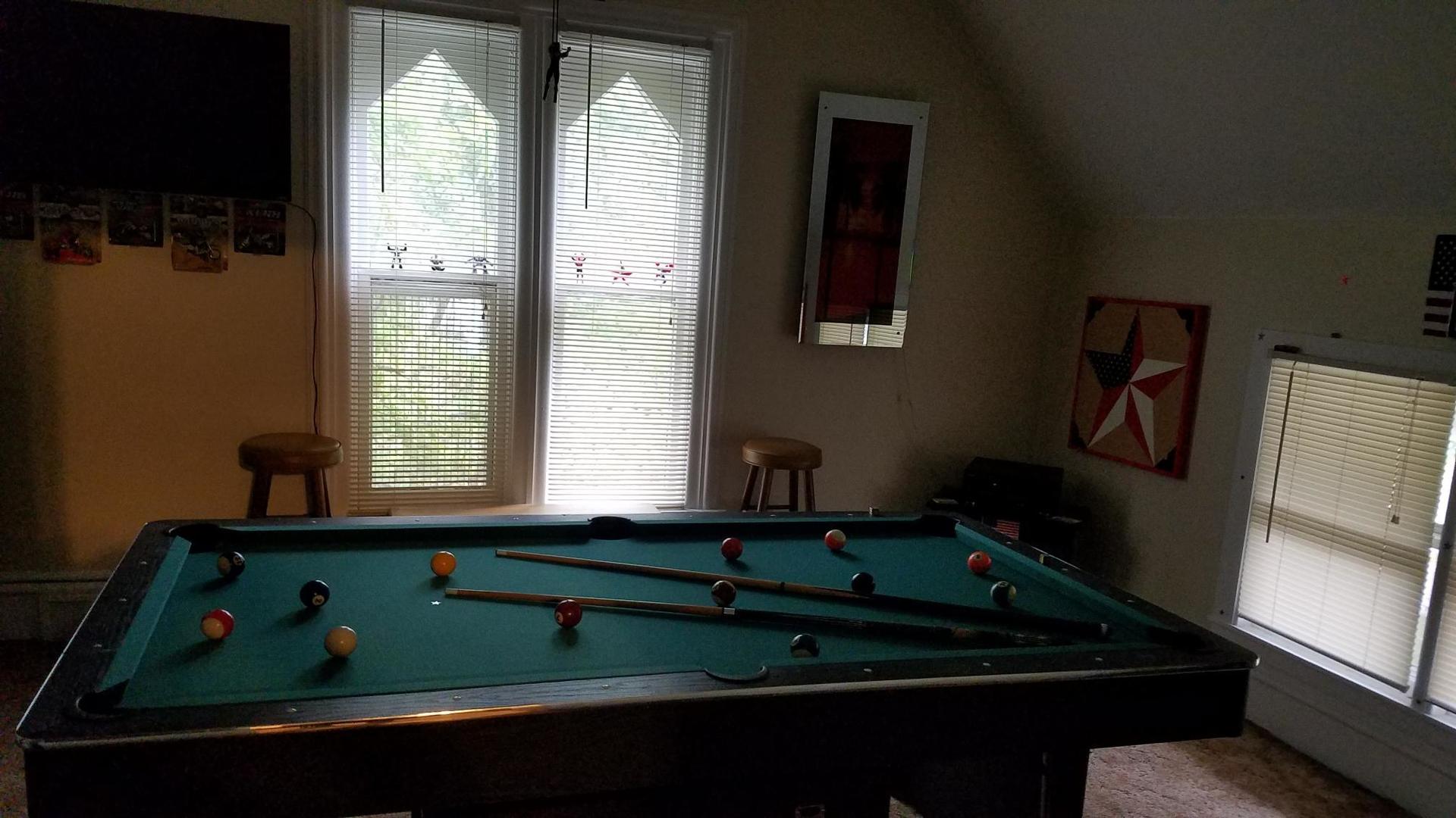 426 North 11th Street Rochelle, IL 61068 - Photo 11 of 18 a room with wooden floor and pool table