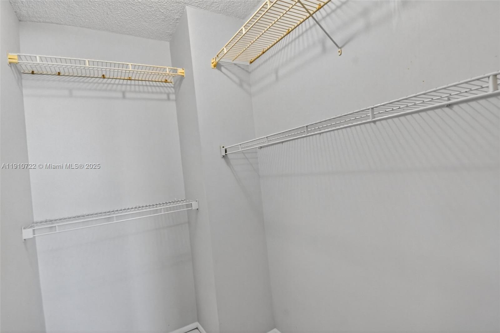 336 North Birch Road, Unit 12B Fort Lauderdale, FL 33304 - Photo 19 of 55 a view of an empty walk in closet
