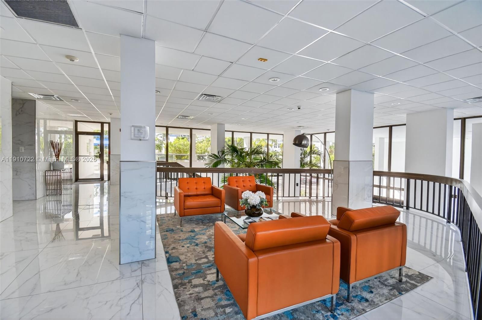 336 North Birch Road, Unit 12B Fort Lauderdale, FL 33304 - Photo 44 of 55 a living room with furniture a ceiling fan and a rug