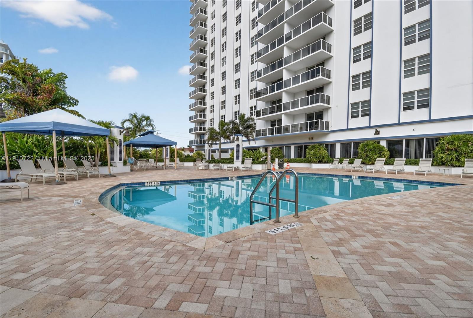 336 North Birch Road, Unit 12B Fort Lauderdale, FL 33304 - Photo 46 of 55 a view of a swimming pool with a lounge chairs
