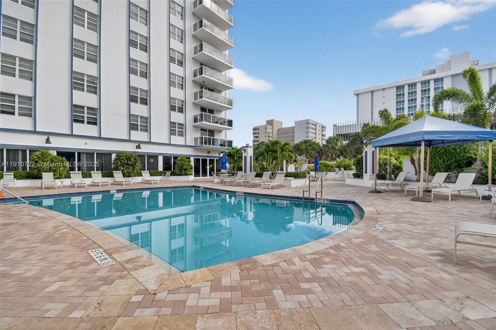 336 North Birch Road, Unit 12B Fort Lauderdale, FL 33304 - Photo 47 of 55 a swimming pool with outdoor seating and yard
