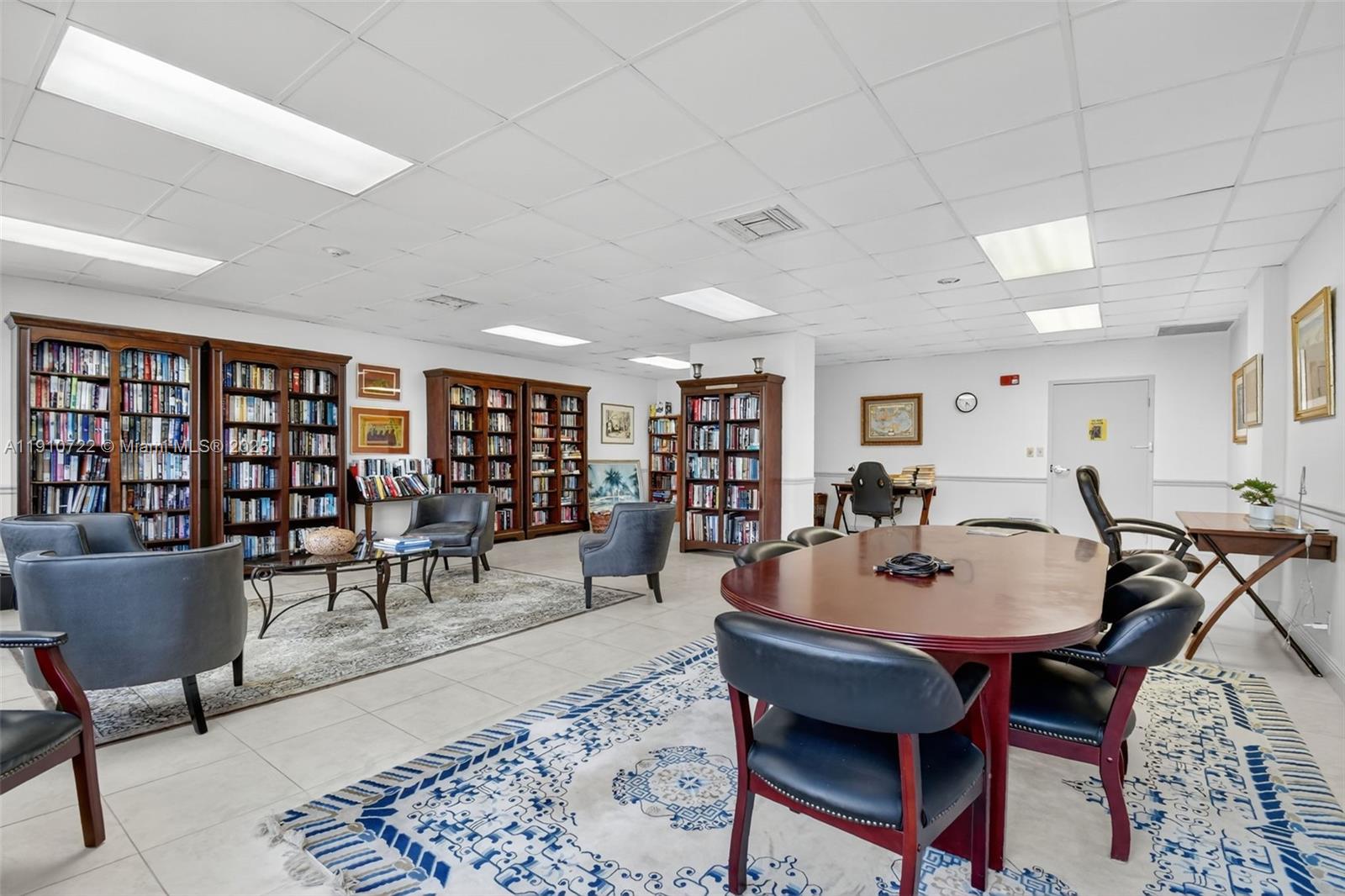 336 North Birch Road, Unit 12B Fort Lauderdale, FL 33304 - Photo 54 of 55 a living room with furniture a table and chairs