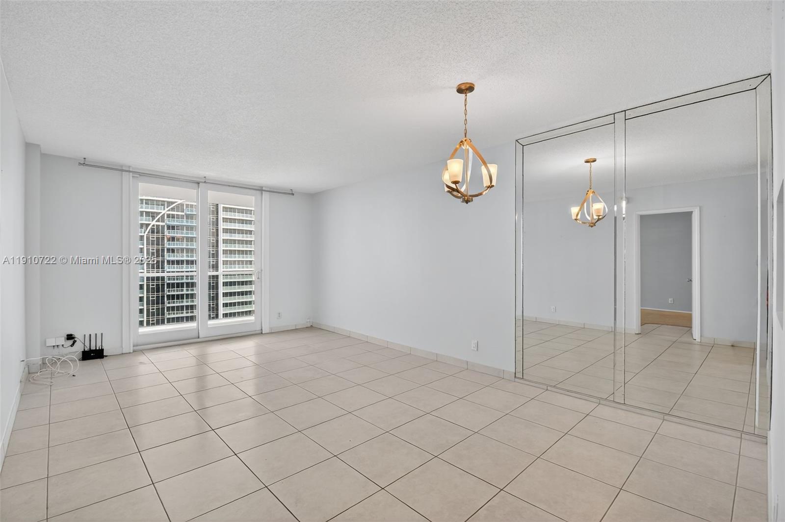 336 North Birch Road, Unit 12B Fort Lauderdale, FL 33304 - Photo 10 of 55 an empty room with fireplace and windows