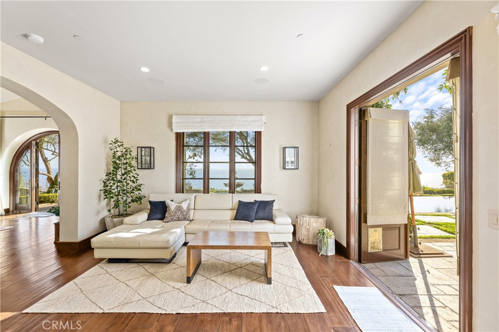 16 Shore Walk Newport Coast, CA 92657 - Photo 20 of 75 a living room with furniture a table and a large window