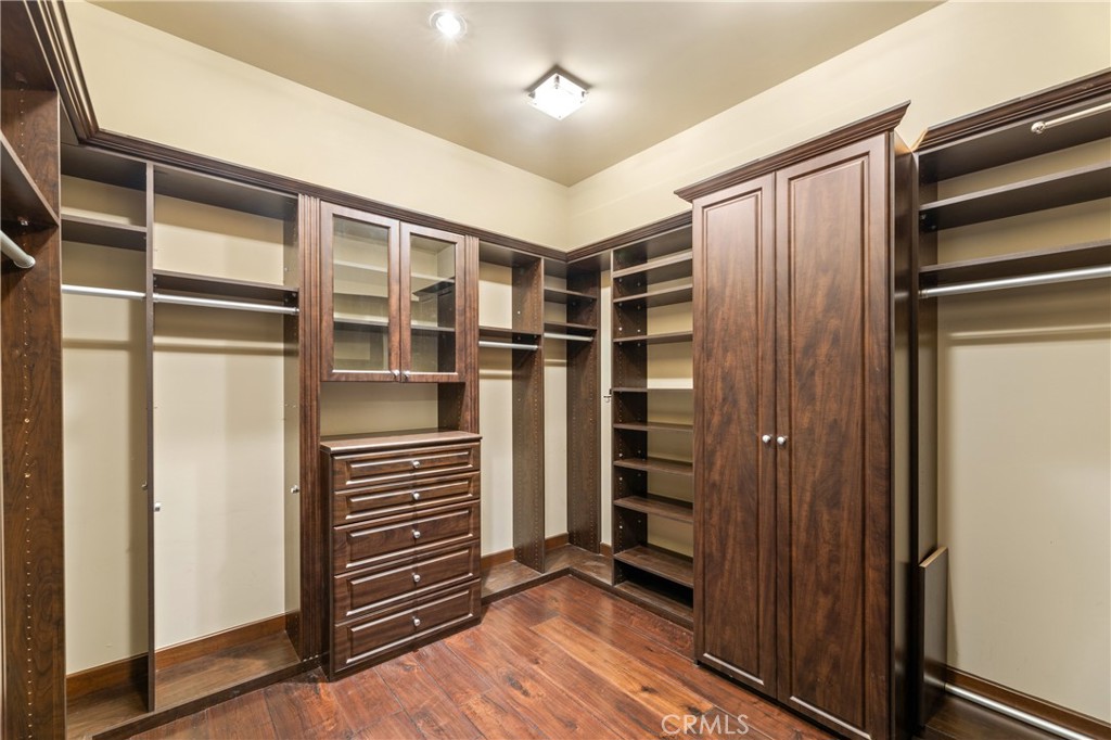 16 Shore Walk Newport Coast, CA 92657 - Photo 33 of 75 a view of walk in closet with wooden floor