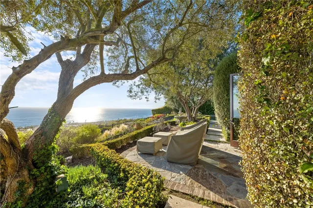 a bathroom with a granite countertop sink a mirror and a shower