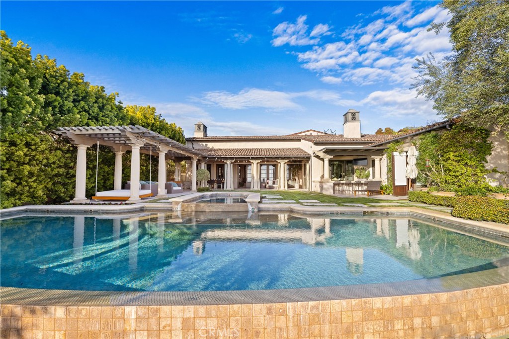 16 Shore Walk Newport Coast, CA 92657 - Photo 37 of 75 a view of a house with pool fire pit a table and chairs
