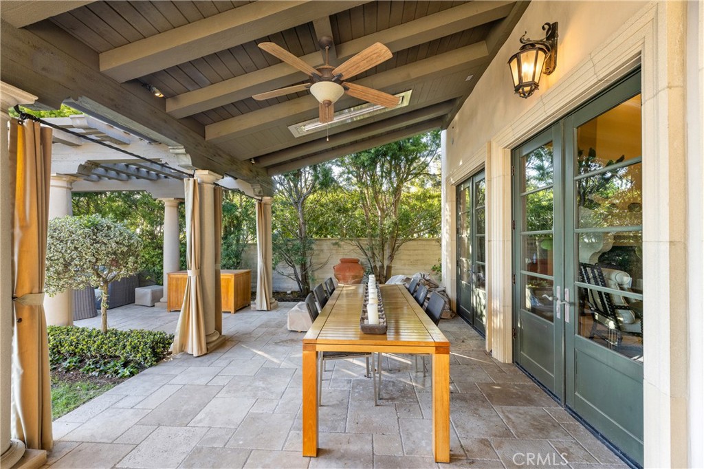 16 Shore Walk Newport Coast, CA 92657 - Photo 41 of 75 a view of a patio with a dining table and chairs