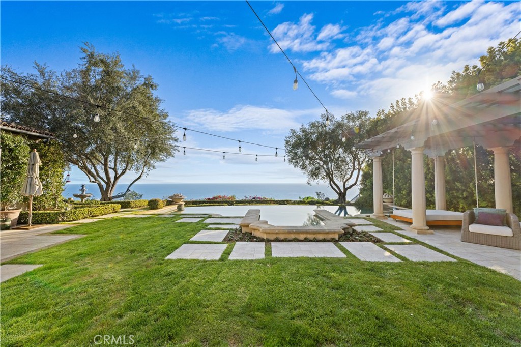 16 Shore Walk Newport Coast, CA 92657 - Photo 43 of 75 a view of backyard with swimming pool and outdoor seating