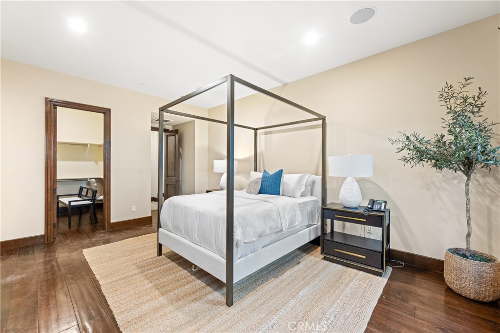 16 Shore Walk Newport Coast, CA 92657 - Photo 47 of 75 a bedroom with a bed table and a potted plant