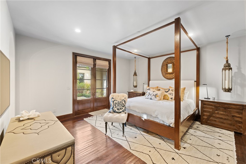 16 Shore Walk Newport Coast, CA 92657 - Photo 51 of 75 a bedroom with a bed and wooden floor