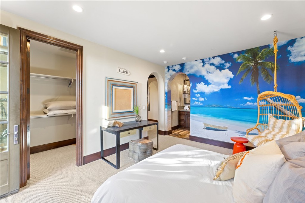 16 Shore Walk Newport Coast, CA 92657 - Photo 57 of 75 a bedroom with a bed and a mirror