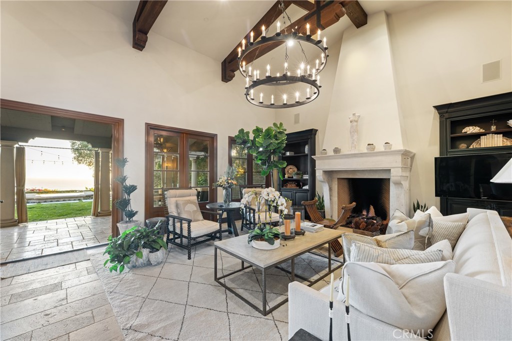 16 Shore Walk Newport Coast, CA 92657 - Photo 66 of 75 a living room with furniture a window and a fireplace