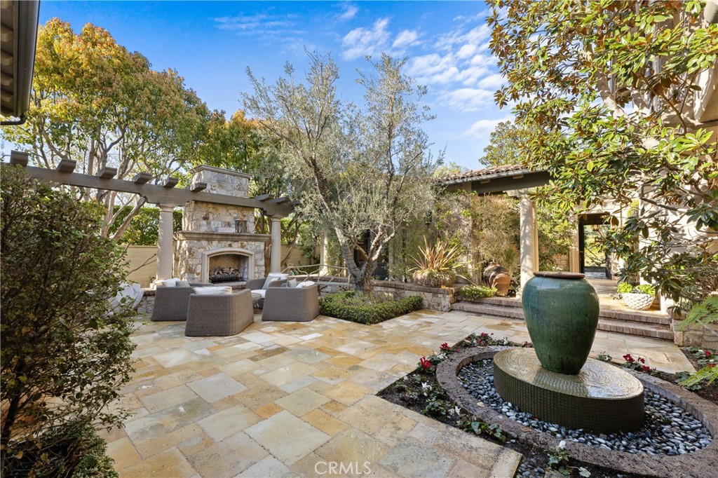 16 Shore Walk Newport Coast, CA 92657 - Photo 10 of 75 a view of a patio with couches potted plants and tree