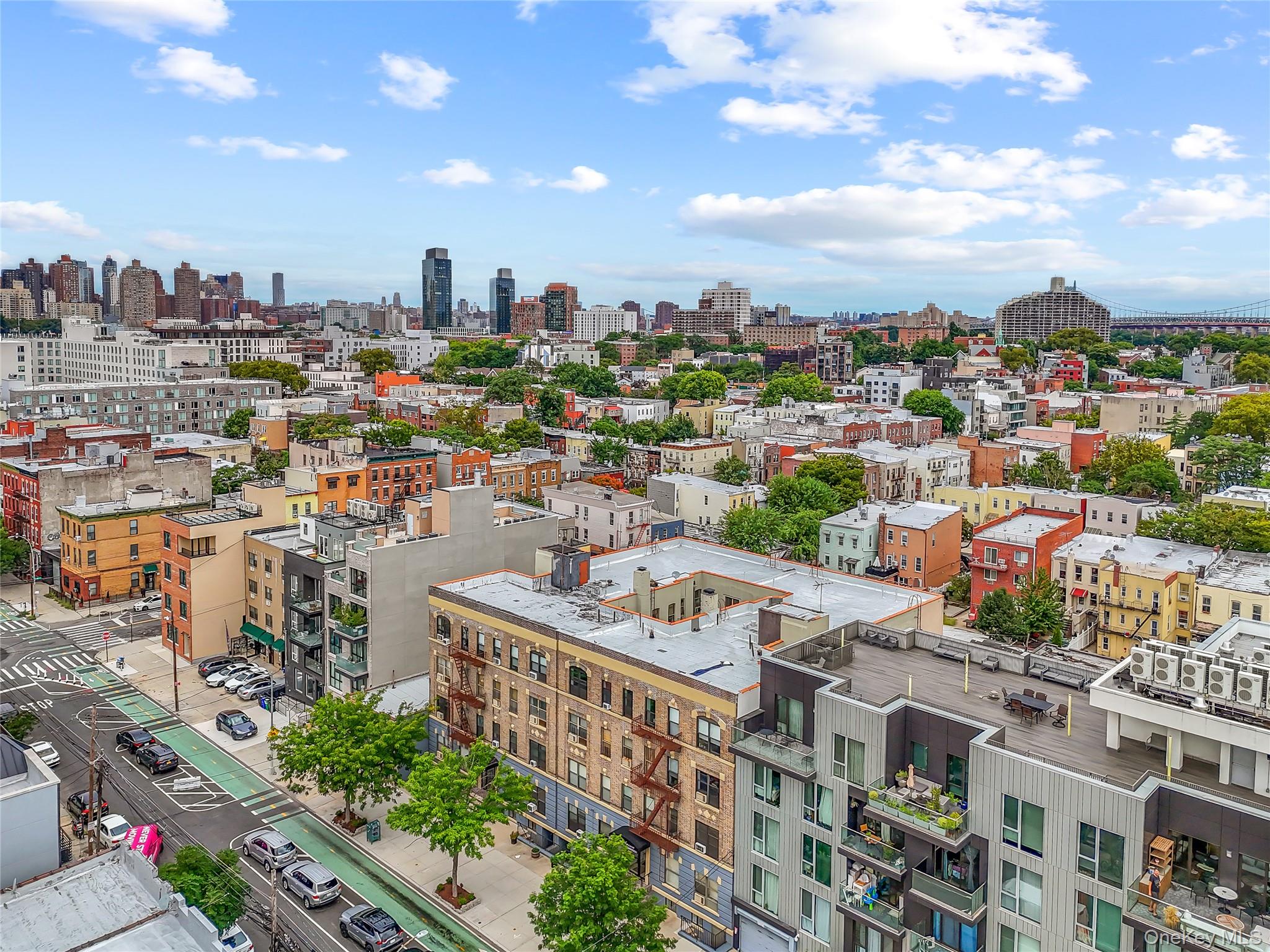 1423 31st Avenue, Unit 4E Queens, NY 11106 - Photo 18 of 23 Drone / aerial view of city skyline