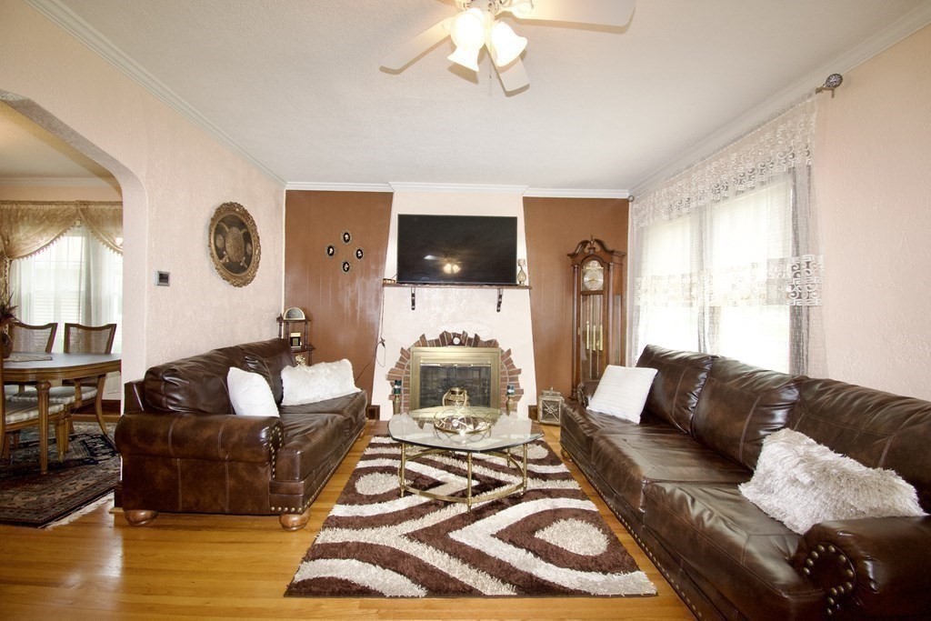 94 Gillette Avenue Springfield, MA 01118 - Photo 11 of 31 a living room with furniture and a flat screen tv